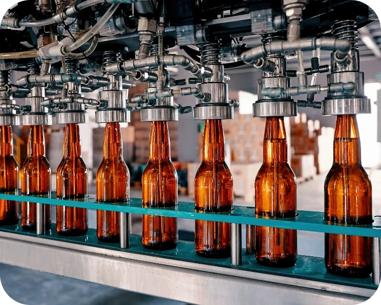 Bottles moving along a manufacturing production line